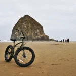 We're preparing for the Cannon Beach Fat Bike Festival 2026 Edition. Here's one of our fat bikes in front of Haystack in Cannon Beach, Oregon.