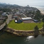 Aerial view looking from the North end of Cannon Beach, Oregon with city and beach Haystack in Background
